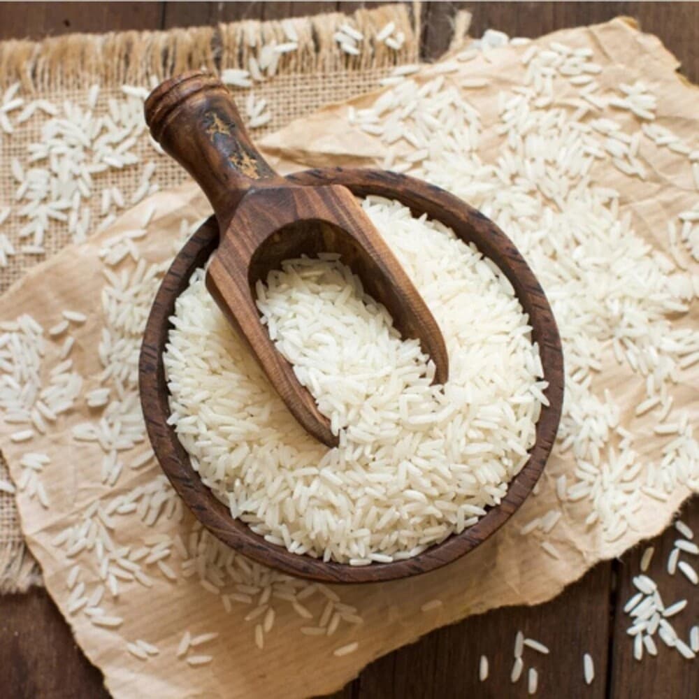 Premium long-grain basmati rice grains in a wooden bowl for export